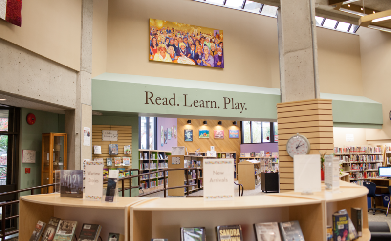 A cozy interior of White Rock Library featuring numerous books neatly arranged on shelves for visitors to explore.