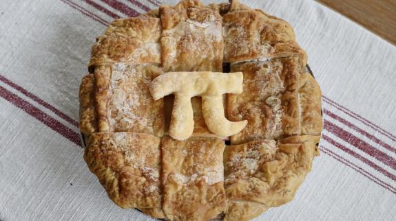 A freshly baked pie with the mathematical pie symbol in celebration of Pi Day on March 14.